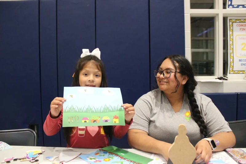 Katherine Tepaz Castillo, 17, helps take care of children as their parents attend the Bilingual Family Literacy Program at Milton Elementary School on May 2. | | SPOTLIGHT DELAWARE PHOTO BY JOSE IGNACIO CASTANEDA PEREZ
