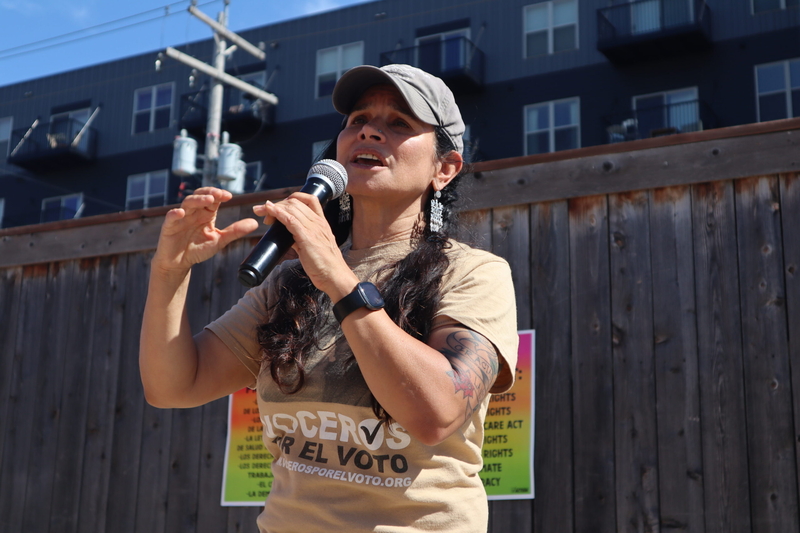 Christine Neumann-Ortiz, executive director of Voces de la Frontera, speaks at a political event in Milwaukee, Wisconsin, on Saturday, Sept. 21. (Isiah Holmes/Wisconsin Examiner)