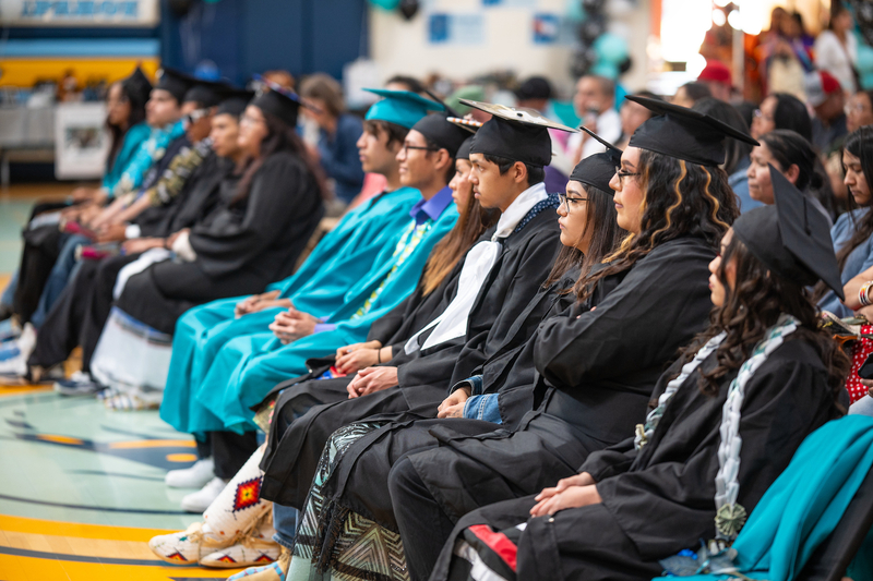 Arapahoe Charter High School’s class of 2024 during graduation. Eight of the 14 graduates planned to attend college or Job Corps. (Kyle Duba/WyoFile)