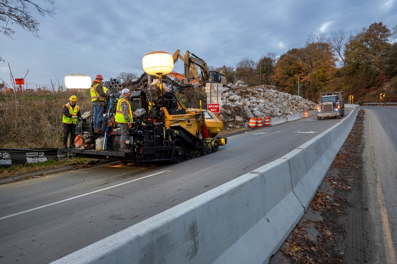 A Connecticut Department of Transportation works on an Interstate 95 bridge on Nov. 05, 2023, in Westport, Connecticut. The Federal Reserve’s rate cut earlier this month could mean lower borrowing costs for state and local governments and bring changes for housing development, tax revenue and road, water and sewer construction. (By John Moore/Getty Images)