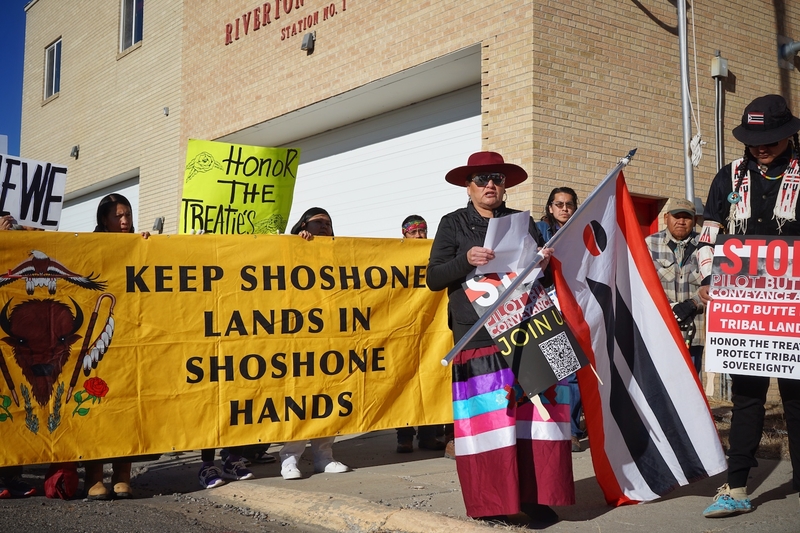Nicole Wagon explains why Wind River Indian Reservation communities oppose the Pilot Butte Power Plant Conveyance Act during a Dec. 5, 2024 protest outside of U.S. Sen. John Barrasso’s Riverton office. Barrasso and Wyoming’s U.S. Rep. Harriet Hageman have pushed companion bills that would require the U.S. Bureau of Reclamation to convey a derelict hydroelectric power plant located within the borders of the reservation to the Midvale Irrigation District. (Katie Klingsporn/WyoFile)