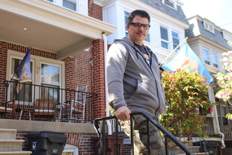 Travis Fogelman, who manages nearly three dozen short-term rental units in Wilmington, stands outside one of his Trolley Square units. He is opposing a restrictive proposal by city council on such rentals. | SPOTLIGHT DELAWARE PHOTO BY JACOB OWENS