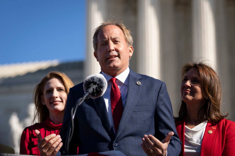 Texas Attorney General Ken Paxton speaks outside the U.S. Supreme Court on Nov. 1, 2021. The Republican has defended his state’s anti-abortion laws in court. (Drew Angerer/Getty Images)