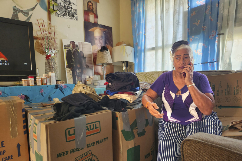 Iutita Momosea, a resident of Kūhiō Park Terrace, sits among packed boxes. She is one of 215 people being forced to leave their homes, which are being torn down as part of a project to develop more affordable housing. (Jeremy Hay/Civil Beat/2025)