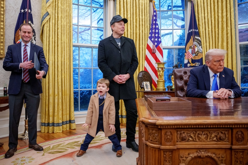 White House staff secretary Will Scharf,  left, Tesla and SpaceX CEO Elon Musk, joined by his son X Musk, center, and President Donald Trump appear for an executive order signing in the Oval Office at the White House on Feb. 11, 2025, in Washington, D.C. (Photo by Andrew Harnik/Getty Images)