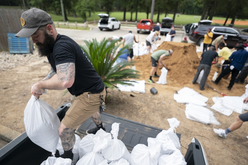 People bag sand in preparation for possible flooding as Tropical Storm Helene, which later became Hurricane Helene, headed toward the state's Gulf Coast on Sept. 25, 2024, in Tallahassee, Florida.  (Photo by Sean Rayford/Getty Images)