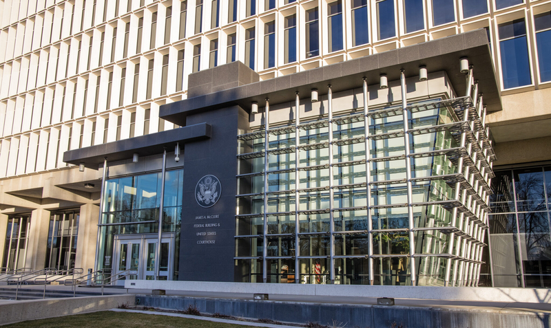 The James A. McClure Federal Building stands partially shadowed in Boise, Idaho.