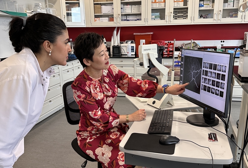 Jennifer Kang-Mieler, right, and PhD student Chaimae Gouya review images they’re using to train an AI model to detect an eye disorder in premature infants. (Photo by Ashley Muliawan/Stevens Institute of Technology)