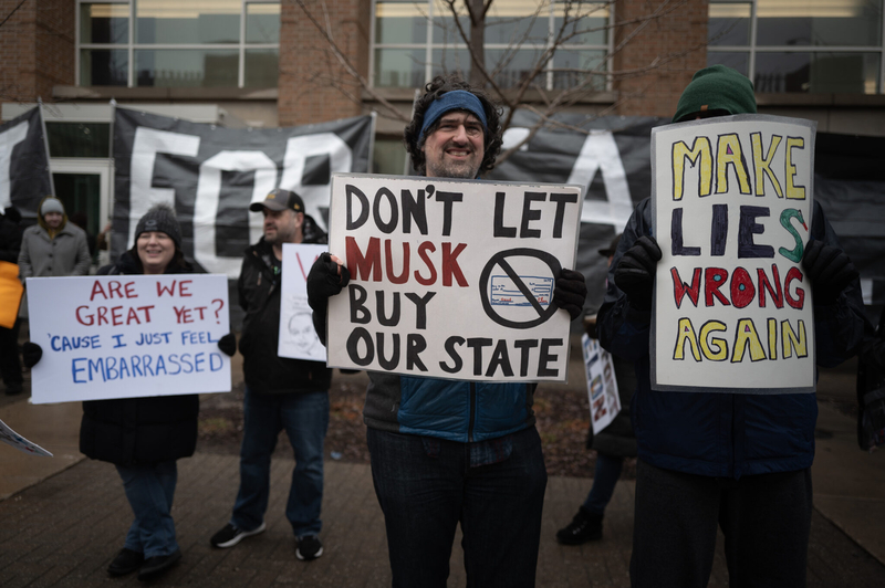 Demonstrators protest outside the KI Convention Center before the start of a town hall meeting with Elon Musk on March 30, 2025 in Green Bay, Wisconsin. (Photo by Scott Olson/Getty Images)