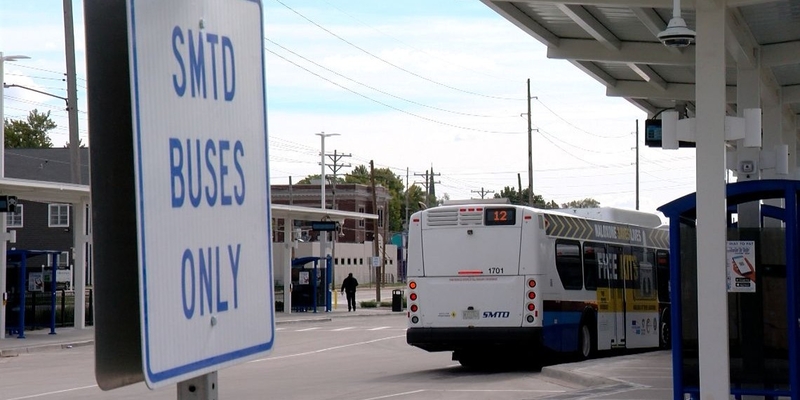 Sangamon Mass Transit District buses wait outside a bus stop in Springfield. (Capitol News Illinois photo by Andrew Campbell)
