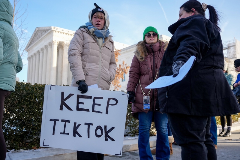 Sarah Baus of Charleston, S.C., holds a sign that reads "Keep TikTok" as she and other content creators Sallye Miley of Jackson, Mississippi, and Callie Goodwin of Columbia, S.C., stand outside the U.S. Supreme Court Building on Jan. 10, 2025, as the court hears oral arguments on whether to overturn or delay a law that could lead to a ban of TikTok in the U.S. (Photo by Andrew Harnik/Getty Images)