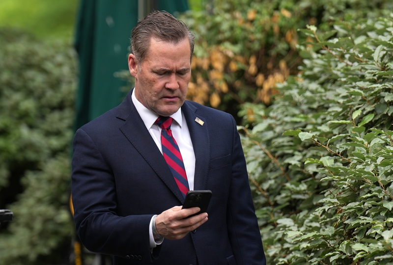 Mike Waltz, national security adviser, looks at his phone as he prepares for a TV interview at the White House on May 01, 2025 in Washington, D.C. (Photo by Andrew Harnik/Getty Images)