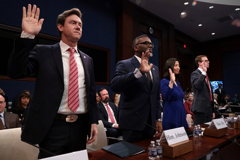 Left to right, Denver Mayor Michael Johnston, Chicago Mayor Brandon Johnson, Boston Mayor Michelle Wu and David J. Bier, director of immigration studies at the Cato Institute, are sworn in during a House Oversight and Government Reform Committee hearing on sanctuary cities' policies at the U.S. Capitol on March 5, 2025 in Washington, D.C.  (Photo by Alex Wong/Getty Images)