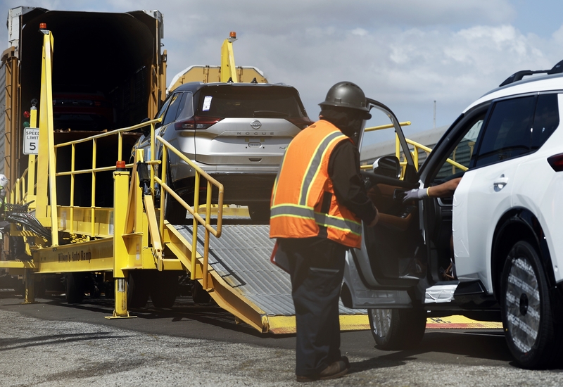 New Nissan cars are driven onto a rail car to be transported from an automobile processing terminal located at the Port of Los Angeles on April 3, 2024, in Wilmington, California.  Tariffs are being levied by President Donald Trump on most foreign vehicles and auto parts.  (Photo by Mario Tama/Getty Images)