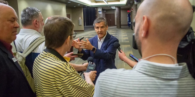 Ted Dabrowski, president of the conservative media outlet Wirepoints, speaks to reporters after telling fellow Republicans he plans to announce a bid for governor soon. (Capitol News Illinois photo by Jerry Nowicki)