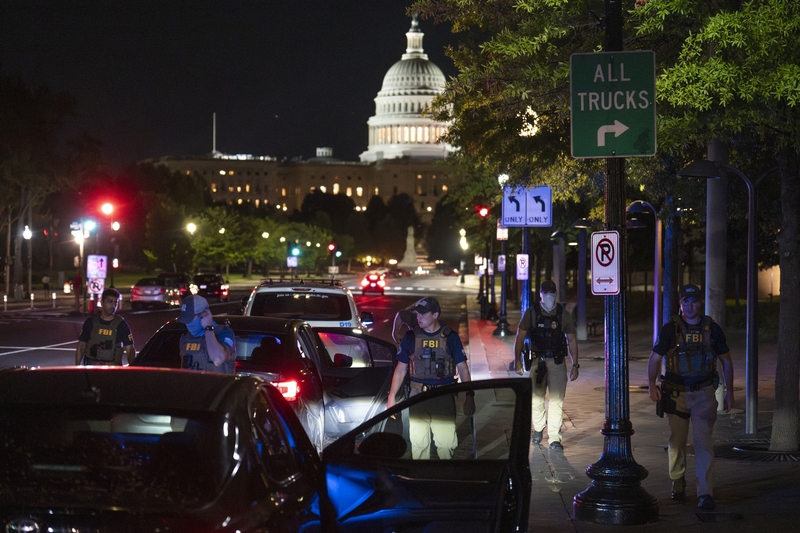 Federal Bureau of Investigation and Metropolitan Police Department officers conduct a traffic stop near the U.S. Capitol on Aug. 14, 2025 in Washington, D.C.  (Photo by Kayla Bartkowski/Getty Images)