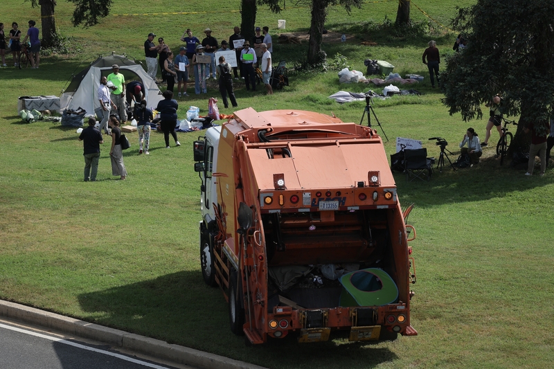 A homeless encampment near the Lincoln Memorial is cleared by employees of the Washington, D.C., government on Aug. 14, 2025. City officials put notices at the camp that they would be breaking it down after President Donald Trump issued his crime emergency" order.  (Photo by Win McNamee/Getty Images)