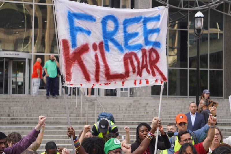 Protesters hold up a sign of support for Kilmar Abrego Garcia outside the ICE office in Baltimore where he was arrested on Monday, Aug. 25, 2025. (Photo by William J. Ford/Maryland Matters)