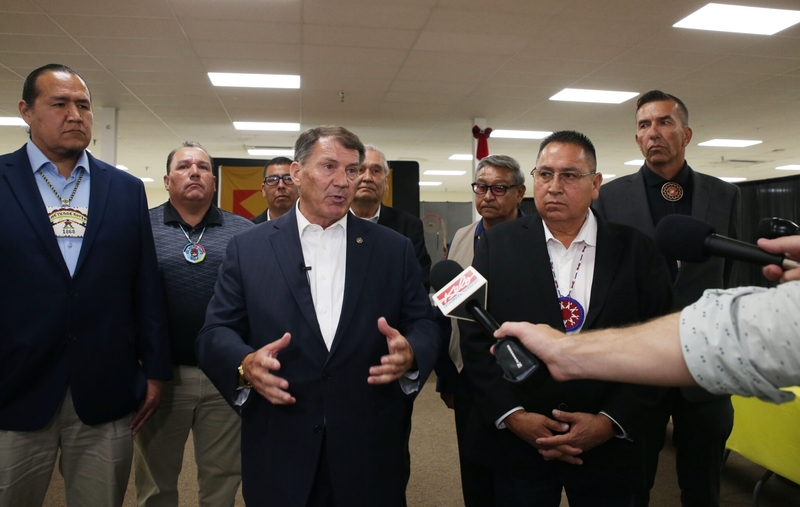 U.S. Sen. Mike Rounds (center) and tribal leaders speak to the media after a public safety roundtable on Aug. 14, 2024, in Wagner, South Dakota. With Rounds, from left, are Cheyenne River Chairman Ryman LeBeau, Lower Brule Chairman Clyde Estes, Sisseton Wahpeton Secretary Curtis Bissonette, Wayne Boyd of Rosebud Sioux Tribe, Yankton Chairman Robert Flying Hawk, Oglala President Frank Star Comes out and Crow Creek Chairman Peter Lengkeek. (Photo by Makenzie Huber/South Dakota Searchlight)