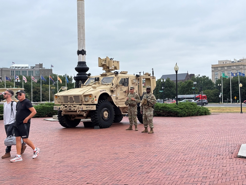 Tourists pass by members of the National Guard stationed outside Union Station in Washington, D.C., on Aug. 18, 2025. (Photo by Jane Norman/States Newsroom)