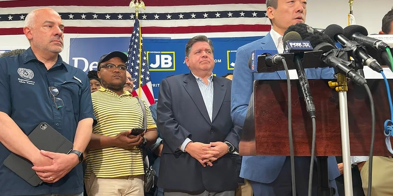Gov. JB Pritzker and Texas House Minority Leader Gene Wu talk to reporters from the DuPage County Democrats headquarters in Carol Stream after Democrats fled Texas to prevent a vote on a Republican-backed congressional redistricting plan. (Capitol News Illinois photo by Hannah Meisel)