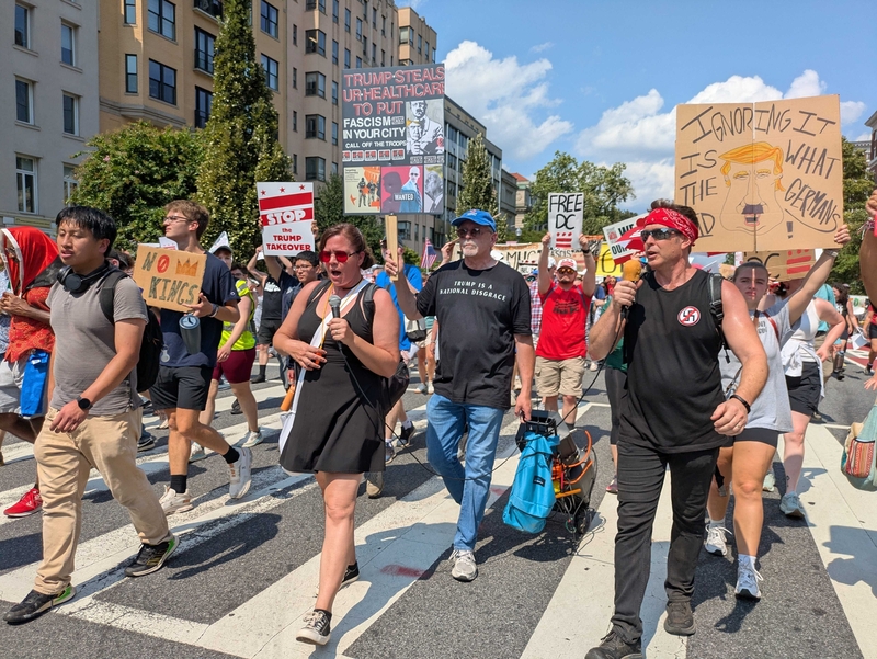 Marchers sang protest songs and led "Trump must go now" chants as they walked down 16th Street NW in Washington, D.C., on Sept. 6, 2025 during the "We Are All DC" demonstration against the deployment of National Guard troops in the nation's capital. (Photo by Ashley Murray/States Newsroom)