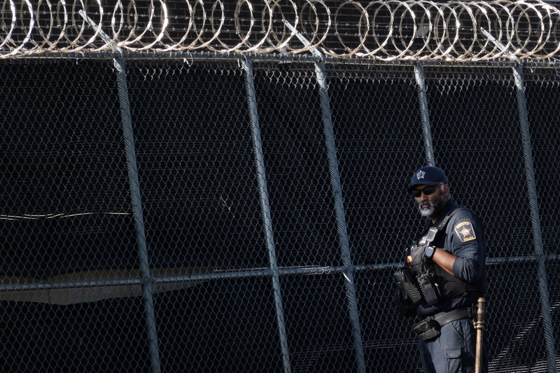 A police officer stands watch as activists protest outside of an Immigration and Customs Enforcement facility on Sept. 5, 2025 in Broadview, Illinois. Immigrants without legal status undergo processing at the facility.  (Photo by Scott Olson/Getty Images)