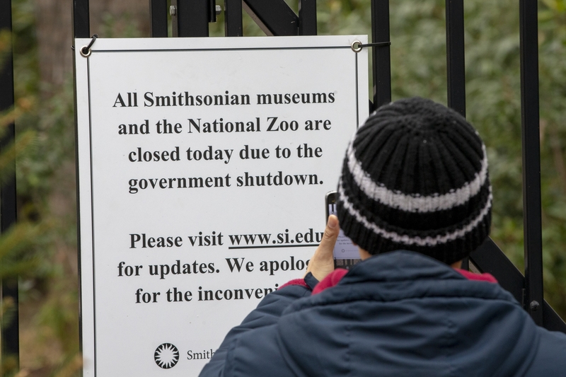 People take photos of the closed signs at the Smithsonian National Zoo, which was closed to the public due to the government shutdown on Jan. 2, 2019 in Washington, D.C.  (Photo by Tasos Katopodis/Getty Images)