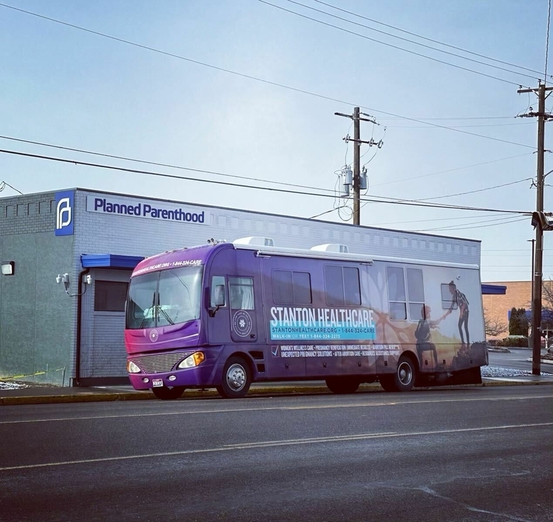 Idaho-based Stanton Healthcare parked its anti-abortion mobile clinic in front of the new Planned Parenthood clinic in Ontario, Oregon, on the same day that the new clinic opened in 2023 after Idaho passed a near-total abortion ban. (Courtesy of Brandi Swindell)