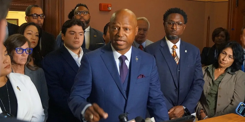 House Speaker Emanuel “Chris” Welch joins members of his caucus at a news conference outside of his Capitol office on Wednesday, Oct. 15, to decry the ongoing aggressive federal immigration enforcement in Chicago. (Capitol News Illinois photo by Peter Hancock)