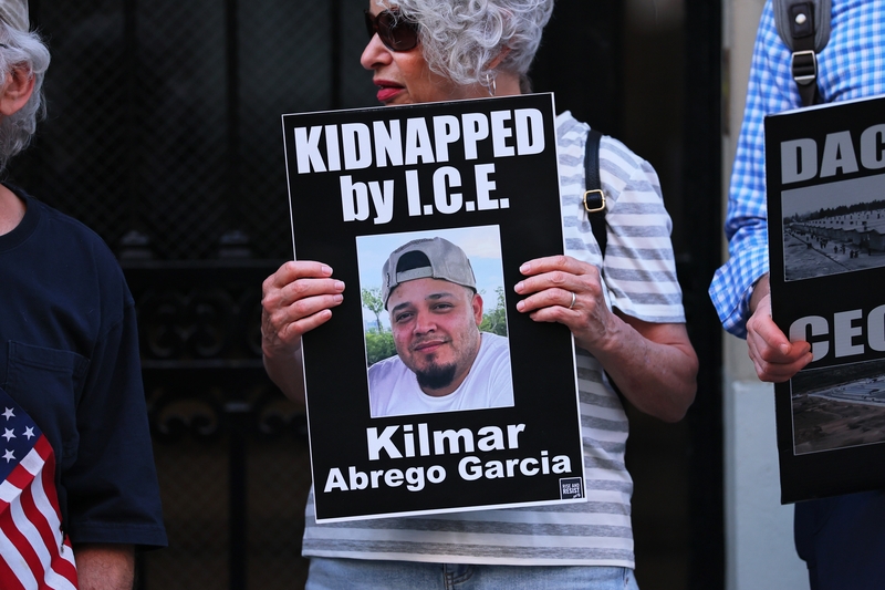A protester holds a photo of Kilmar Abrego Garcia as demonstrators gather to protest against the deportation of immigrants to El Salvador outside the Permanent Mission of El Salvador to the United Nations on April 24, 2025 in New York City.  (Photo by Michael M. Santiago/Getty Images)