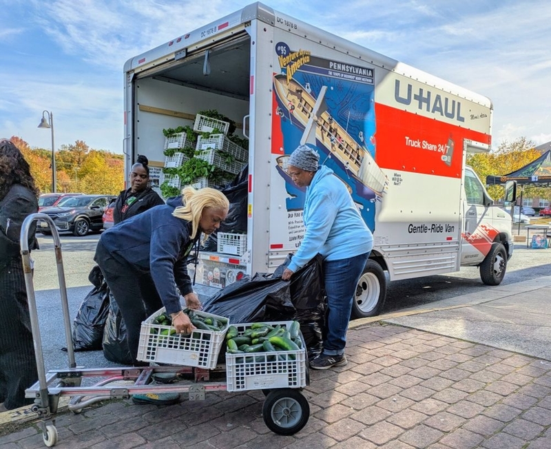 Volunteers from No Limits Outreach Ministries in Hyattsville, Maryland, and the Capital Area Food Bank prepare for distribution on Oct. 28, 2025 to furloughed federal workers affected by the government shutdown. People with government employment ID began lining up hours ahead of time. (Photo by Ashley Murray/States Newsroom)