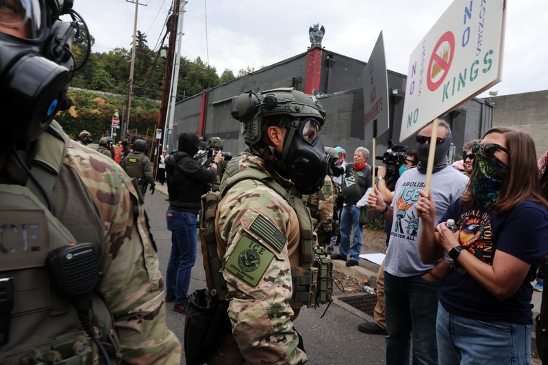 Federal agents, including members of the Department of Homeland Security, the Border Patrol, and police, attempt to keep protesters back outside a downtown U.S. Immigration and Customs Enforcement facility on Oct. 4, 2025 in Portland, Oregon.  (Photo by Spencer Platt/Getty Images)