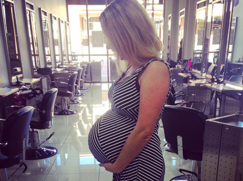 Idaho resident Lynlee Lord stands pregnant in a salon.