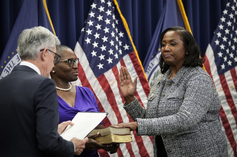 Chair of the Federal Reserve Jerome Powell, left, administers the oath of office to Lisa Cook, right, to serve as a member of the Board of Governors at the Federal Reserve System during a ceremony at the William McChesney Martin Jr. Building of the Federal Reserve May 23, 2022 in Washington, D.C.  (Photo by Drew Angerer/Getty Images)