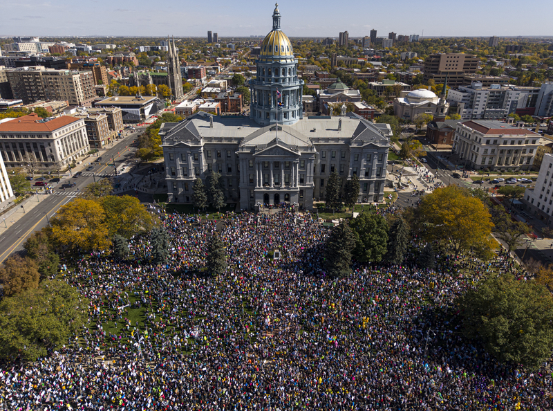 Thousands of demonstrators gather on the west side of the Colorado Capitol