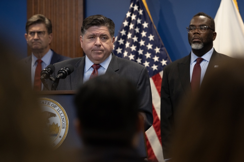 Illinois Gov. JB Pritzker speaks at a news conference in Chicago on Oct. 6, 2025. Chicago Mayor Brandon Johnson stands at right. (Photo by Scott Olson/Getty Images)