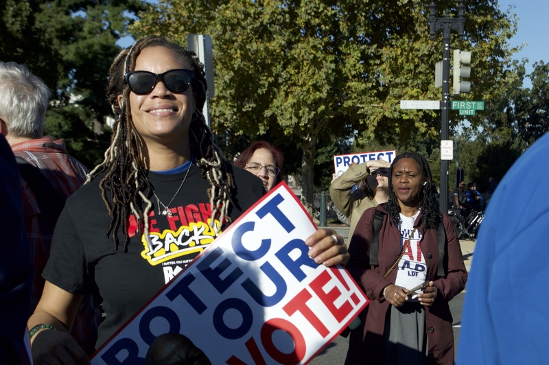 Saudia Bradley, 47, of Gainesville, Florida, danced to Civil Rights-era anthems between speeches at a rally outside the U.S. Supreme Court on Wednesday, Oct. 15, 2025. (Photo by Ashley Murray/States Newsroom)
