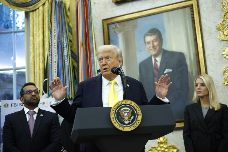 President Donald Trump speaks as Federal Bureau of Investigation Director Kash Patel, left, and U.S. Attorney General Pam Bondi look on during a press conference in the Oval Office of the White House on Oct. 15, 2025 in Washington, D.C. (Photo by Kevin Dietsch/Getty Images)