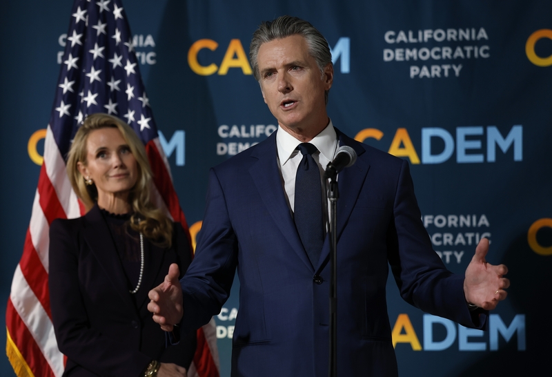 California Gov. Gavin Newsom speaks as his wife Jennifer Siebel Newsom looks on during an election night gathering at the California Democrats' headquarters on Nov. 4, 2025 in Sacramento. (Photo by Justin Sullivan/Getty Images)