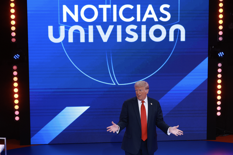 DORAL, FLORIDA - OCTOBER 16: Republican presidential nominee, former U.S. President Donald Trump gestures during a Univision Noticias town hall event on October 16, 2024 in Doral, Florida. Trump addressed undecided Latino voters as he continues campaigning against his rival, Democratic presidential nominee, U.S. Vice President Kamala Harris. (Photo by Joe Raedle/Getty Images)