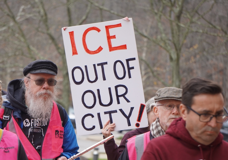 A rallygoer holds up a sign critical of U.S. Immigration and Customs Enforcement outside the courthouse in Greenbelt, Maryland, on Nov. 20, 2025. (Photo by William J. Ford/Maryland Matters)