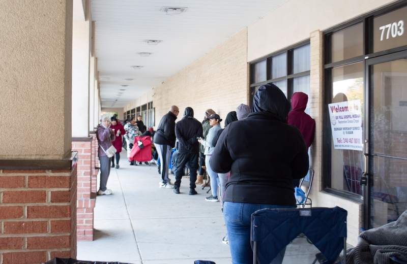 Furloughed federal workers stand in line for hours ahead of a special food distribution by the Capital Area Food Bank and No Limits Outreach Ministries on Barlowe Road in Hyattsville, Maryland, on Tuesday, Oct. 28, 2025. (Photo by Ashley Murray/States Newsroom)