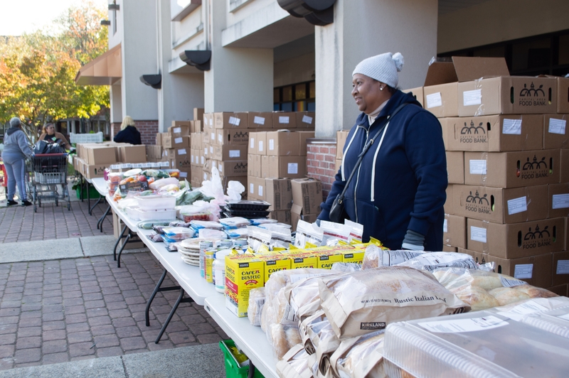 Volunteers with the Capital Area Food Bank distribute items to furloughed federal workers in partnership with No Limits Outreach Ministries in Hyattsville, Maryland, on Oct. 28, 2025. (Photo by Ashley Murray/States Newsroom)
