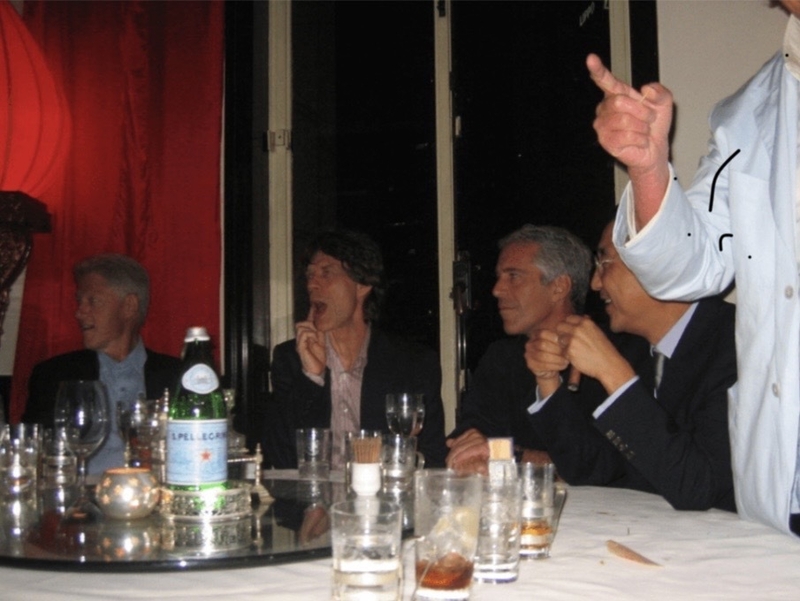 Former President Bill Clinton, rock star Mick Jagger and the late sex offender Jeffrey Epstein are seated at a table in this undated photo released as part of the Epstein files on Friday, Dec. 19, 2025, by the Department of Justice. Clinton has denied any connection to Epstein's alleged crimes. (Photo from Department of Justice)