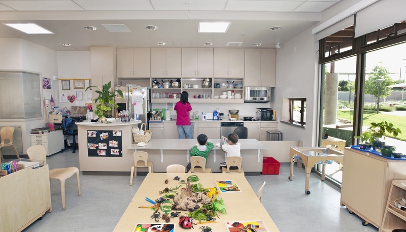 A preschool teacher prepares lunch for students inside a day care center. (Photo by Billy Hustace/Getty Images)