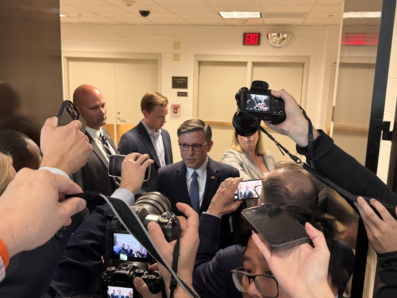 U.S. House Speaker Mike Johnson, R-La., talks with reporters inside the Capitol building in Washington, D.C., on Tuesday, Oct. 21, 2025.
