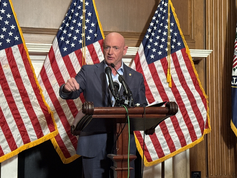 Arizona Democratic Sen. Mark Kelly speaks with reporters in the Mansfield Room of the U.S. Capitol building in Washington, D.C., on Monday, Dec. 1, 2025.
