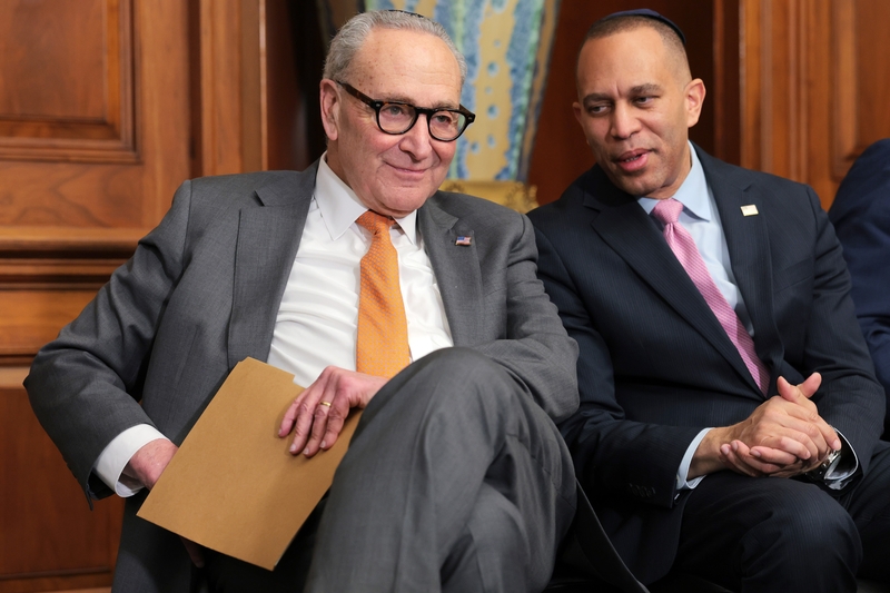 Senate Minority Leader Chuck Schumer, D-N.Y., speaks to House Minority Leader Hakeem Jeffries, D-N.Y.,  during a Hanukkah reception at the U.S. Capitol Building on Dec. 10, 2025 in Washington, D.C. (Photo by Anna Moneymaker/Getty Images)