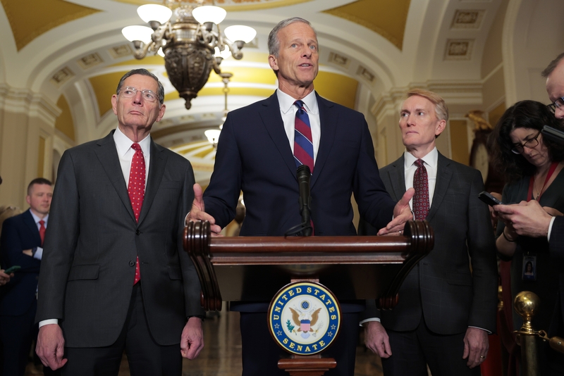 Senate Majority Leader John Thune, R-S.D., center, joined by Senate Majority Whip John Barrasso, R-Wyo., left, and Sen. James Lankford, R-Okla., speaks to reporters following a Senate Republican policy luncheon at the U.S. Capitol on Dec. 9, 2025 in Washington, D.C.  (Photo by Heather Diehl/Getty Images)